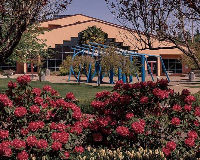 RTC Building I in the background, bushes and flowers in the foreground
