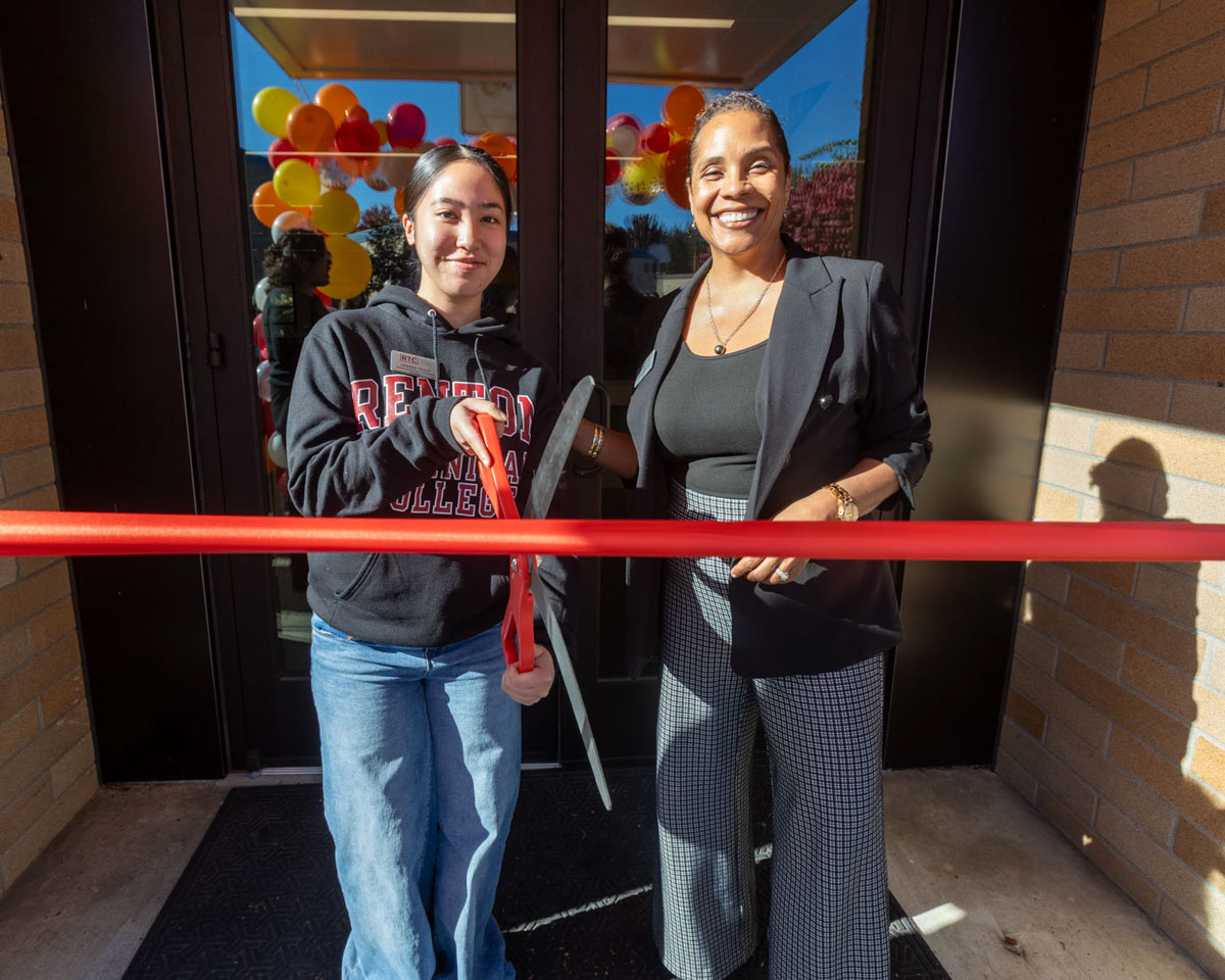 Dr. Yo and student smiling at the ribbon cutting event for the Unity Center