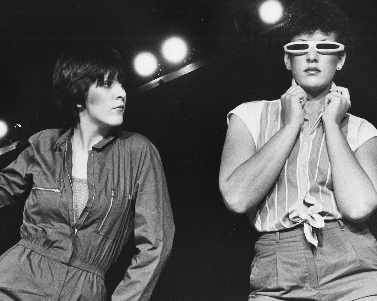 black and white photo of students modeling the latest fashions of the time