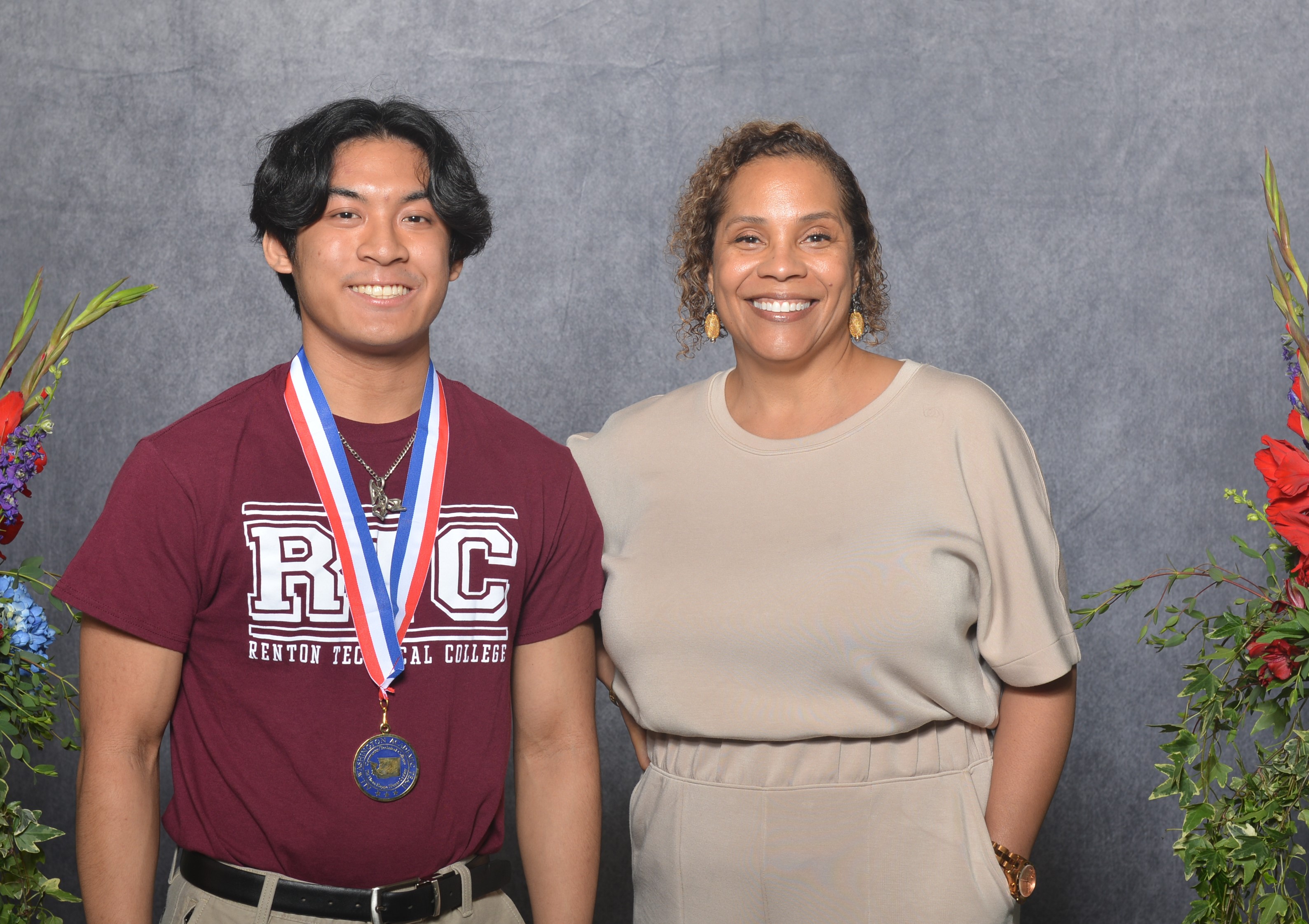 Leo Ragual and Dr. Yoshiko Harden celebrate Ragual's academic success