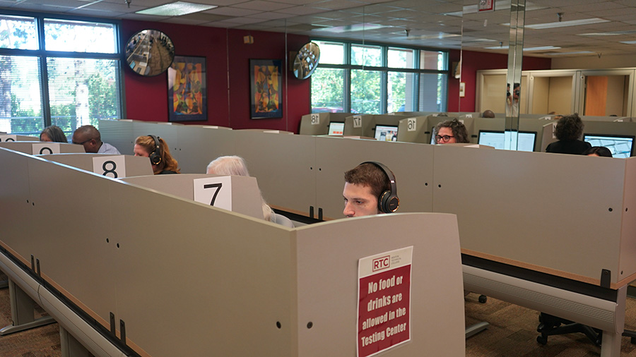 A group of people using computers at the RTC Testing Center