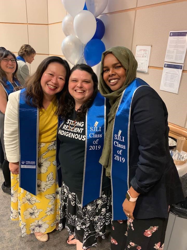 Maizy B (center) at the Social Justice Leadership Institute graduation prior to joining RTC and King County's Promise initiative.