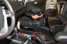 student working on car interior